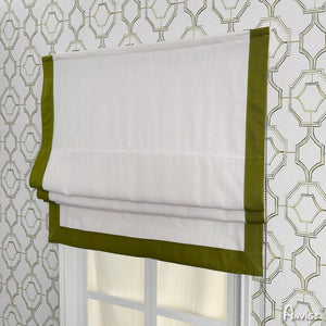 Flat Roman shade with green border and white fabric, installed on a window with geometric wallpaper. Customizable and easy to install.