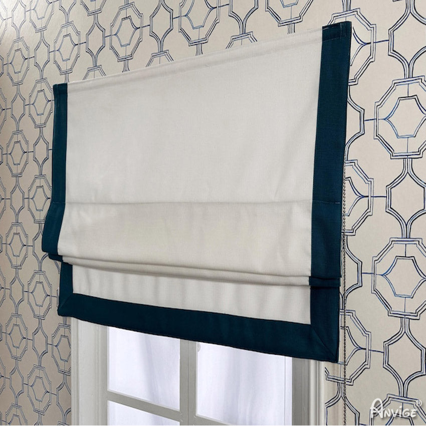 Side view of a flat Roman shade in white with teal border, showcasing its sleek design and easy installation on a window frame.