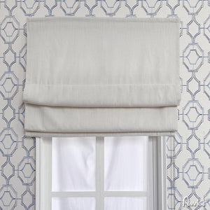 Anvige Flat Roman Shades in light fabric, mounted on a window with geometric wallpaper. Customizable for light filtering or blackout.