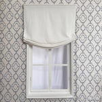 Relax Roman Shades in white fabric, custom-fit for windows, featuring a light-filtering design with a soft draped style.