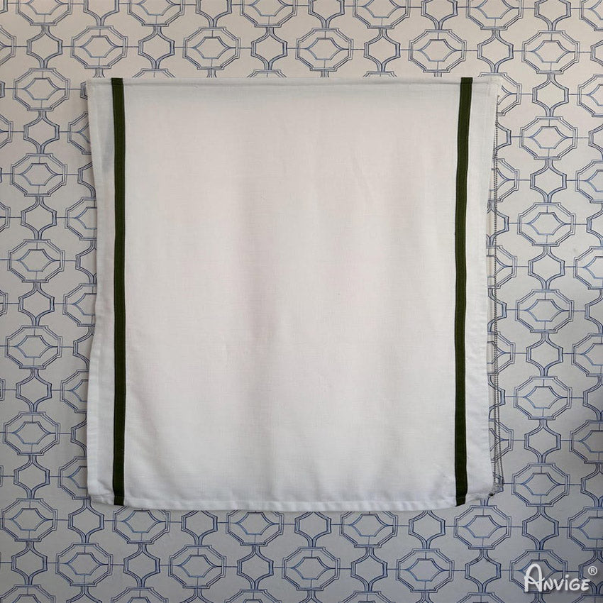 Anvige Roman Shades fully extended in white fabric with green trim, displayed against geometric-patterned wallpaper. Customizable window treatment.